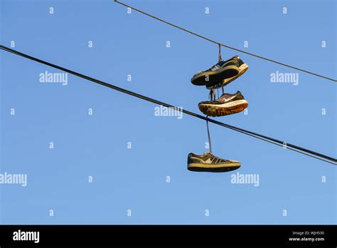 tennis shoes on power lines